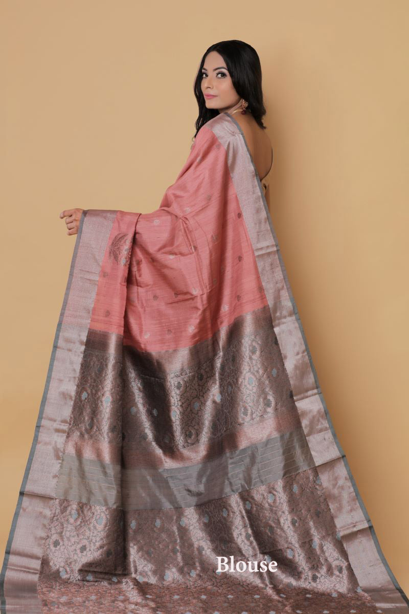 Banarasi Tussar Silk Saree has floral motifs handwoven in Zari makes it a zari border silk saree.