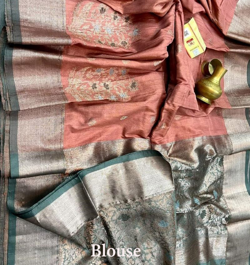 Banarasi Tussar Silk Saree has floral motifs handwoven in Zari makes it a zari border silk saree.